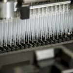 Automated liquid-handling system processing DNA samples in microplates, illustrating a high-throughput molecular laboratory workflow.